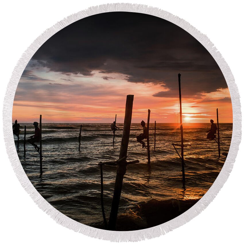 Fisherman Round Beach Towel featuring the photograph Sunset and Stilt Fishermen by Arj Munoz