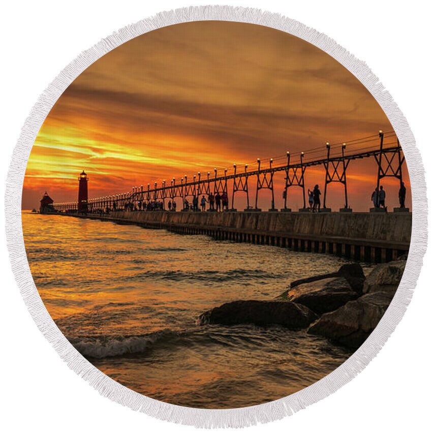 Grand Haven Round Beach Towel featuring the digital art Sunset at Grand Haven Lighthouse by Kevin McClish