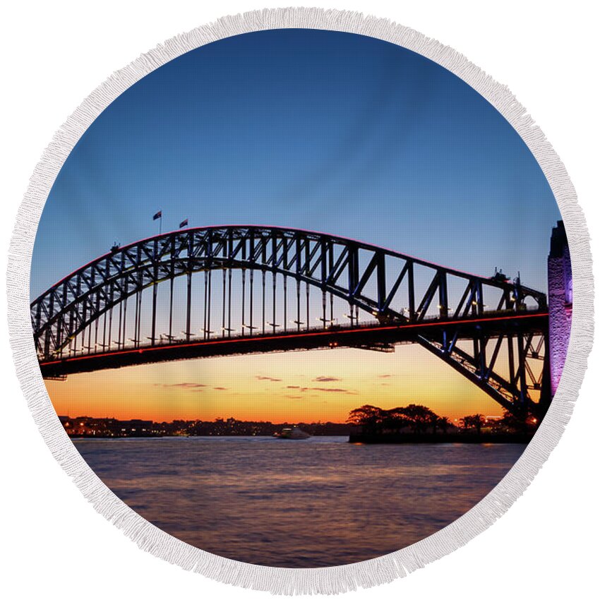 Arch Round Beach Towel featuring the photograph Sydney Harbour Bridge illuminated at sunset by Rick Deacon