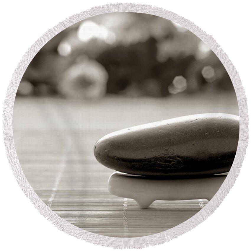 Meditative Round Beach Towel featuring the photograph Symbolic Zen Inspired Stone in a Spa by Olivier Le Queinec