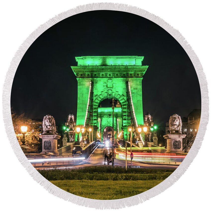 Budapest Round Beach Towel featuring the photograph The Chain Bridge in Budapest illuminated in Kelly Green for St. Patrick's Day. by Tito Slack