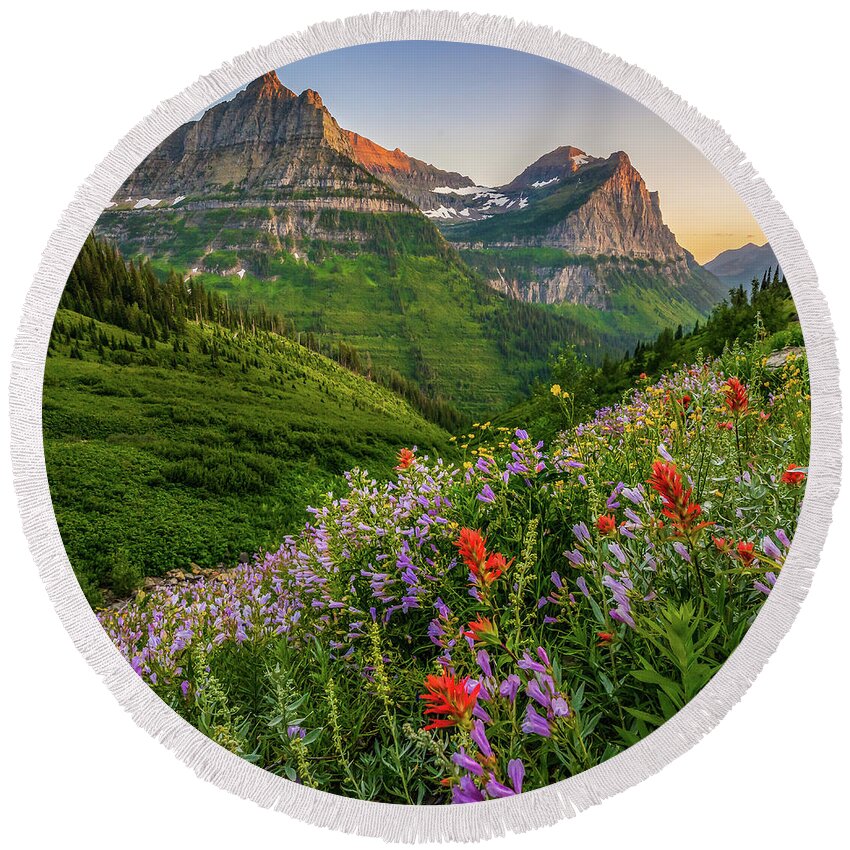 Landscape Round Beach Towel featuring the photograph Wild flowers at sunset in Glacier National Park by Robert Miller