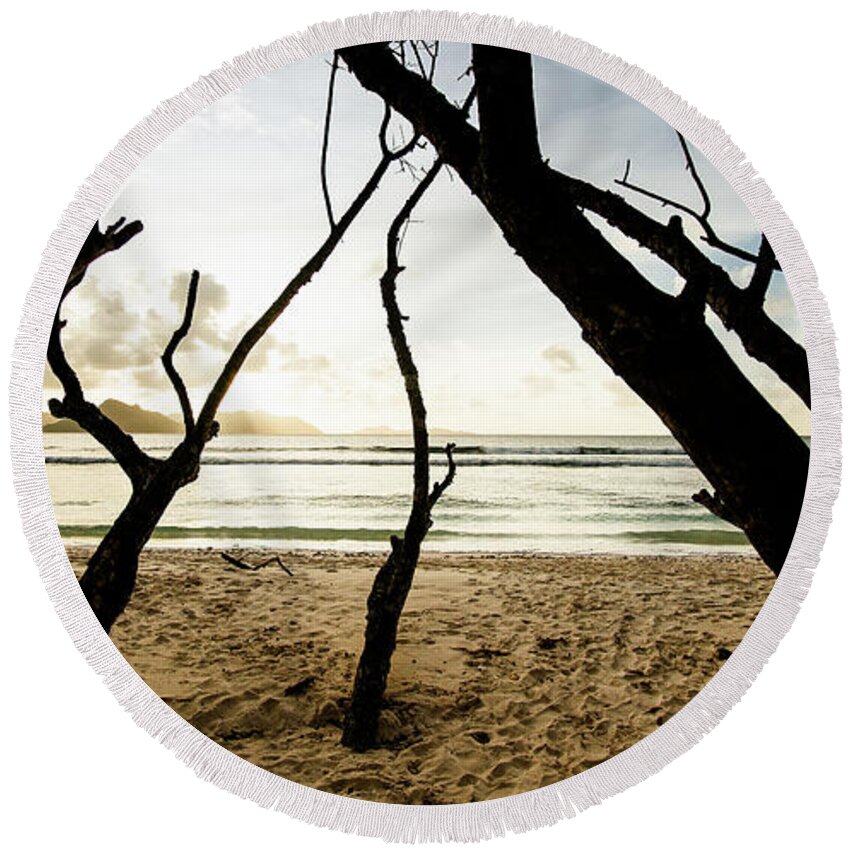 Background Round Beach Towel featuring the photograph Trees silhouette at sunset in Seychelles by Jean-Luc Farges