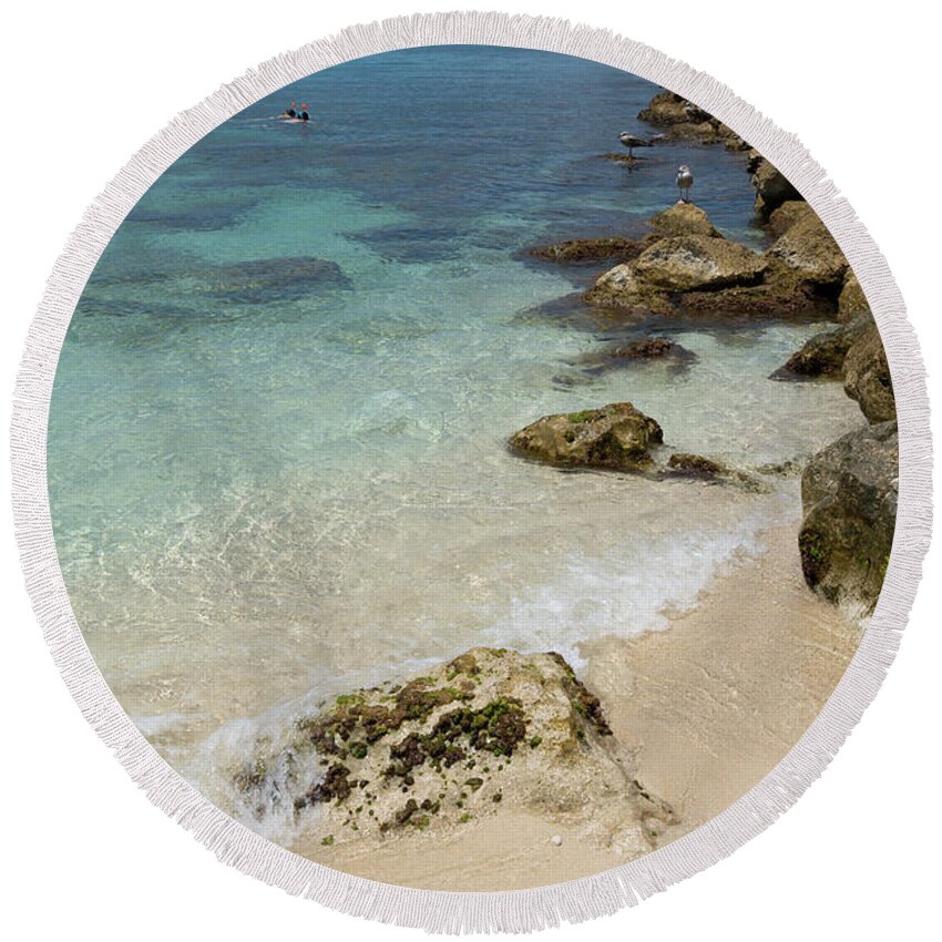 Mediterranean Round Beach Towel featuring the photograph Turquoise blue sea water and rocks in Calpe 3 by Adriana Mueller