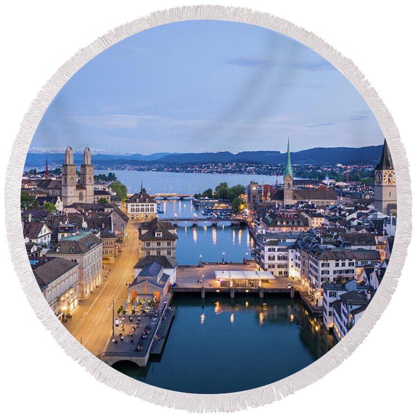 Europe Round Beach Towel featuring the photograph Twilight over Zurich old town along the Limmat river in Switzer by Didier Marti