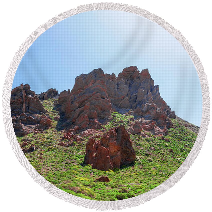 Mountains Round Beach Towel featuring the photograph Vegetation surrounding red lava rocks by Sun Travels