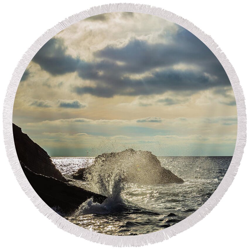Wave Round Beach Towel featuring the photograph Wave crashing on rocks by Fabiano Di Paolo