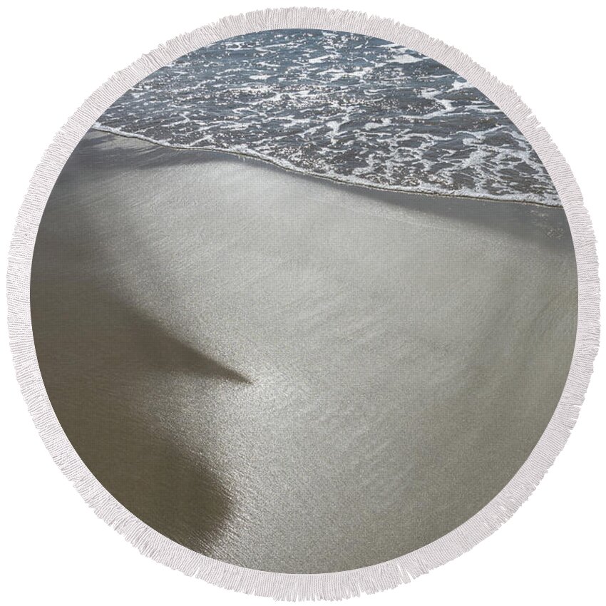 Sandy Beach Round Beach Towel featuring the photograph Wet sand, sea water and reflections of sunlight by Adriana Mueller