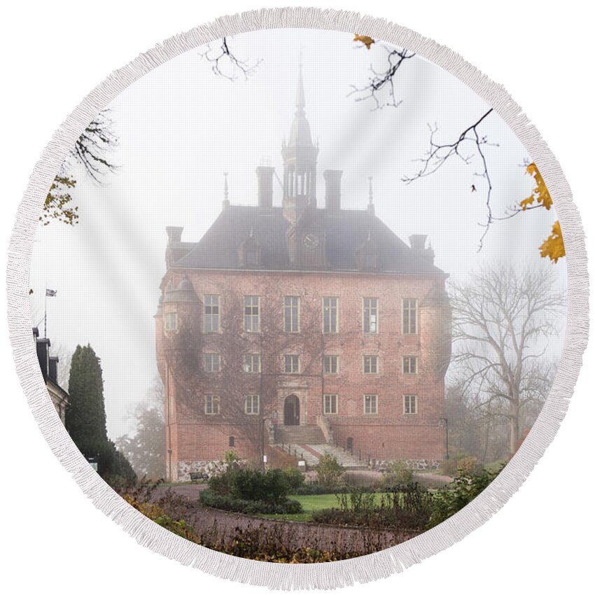Wik Castle Round Beach Towel featuring the photograph Wik Castle a foggy autumn morning by Torbjorn Swenelius