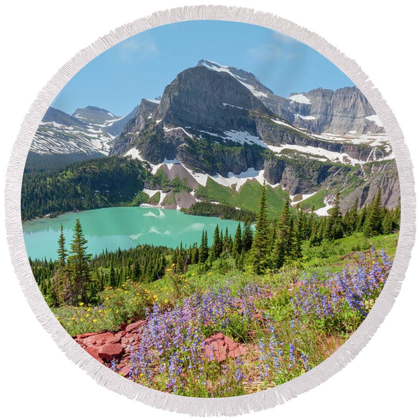 Glacier National Park Round Beach Towel featuring the photograph Wildflowers above Grinnell Lake by Jack Bell