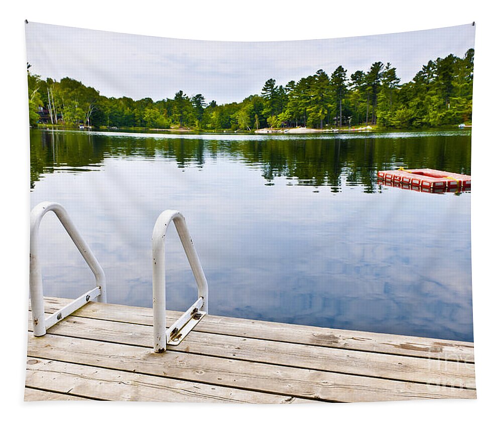 Dock Tapestry featuring the photograph Dock on calm lake in cottage country by Elena Elisseeva