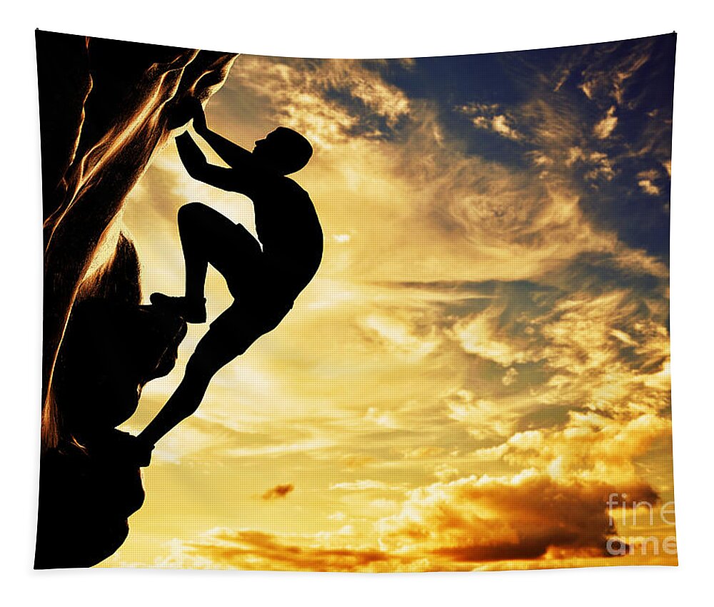 Climb Tapestry featuring the photograph A silhouette of man free climbing on rock mountain at sunset by Michal Bednarek