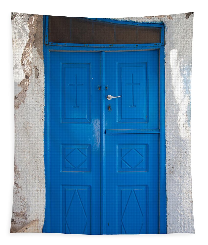 Blue Tapestry featuring the photograph Blue door of a church in Santorini by Matteo Colombo