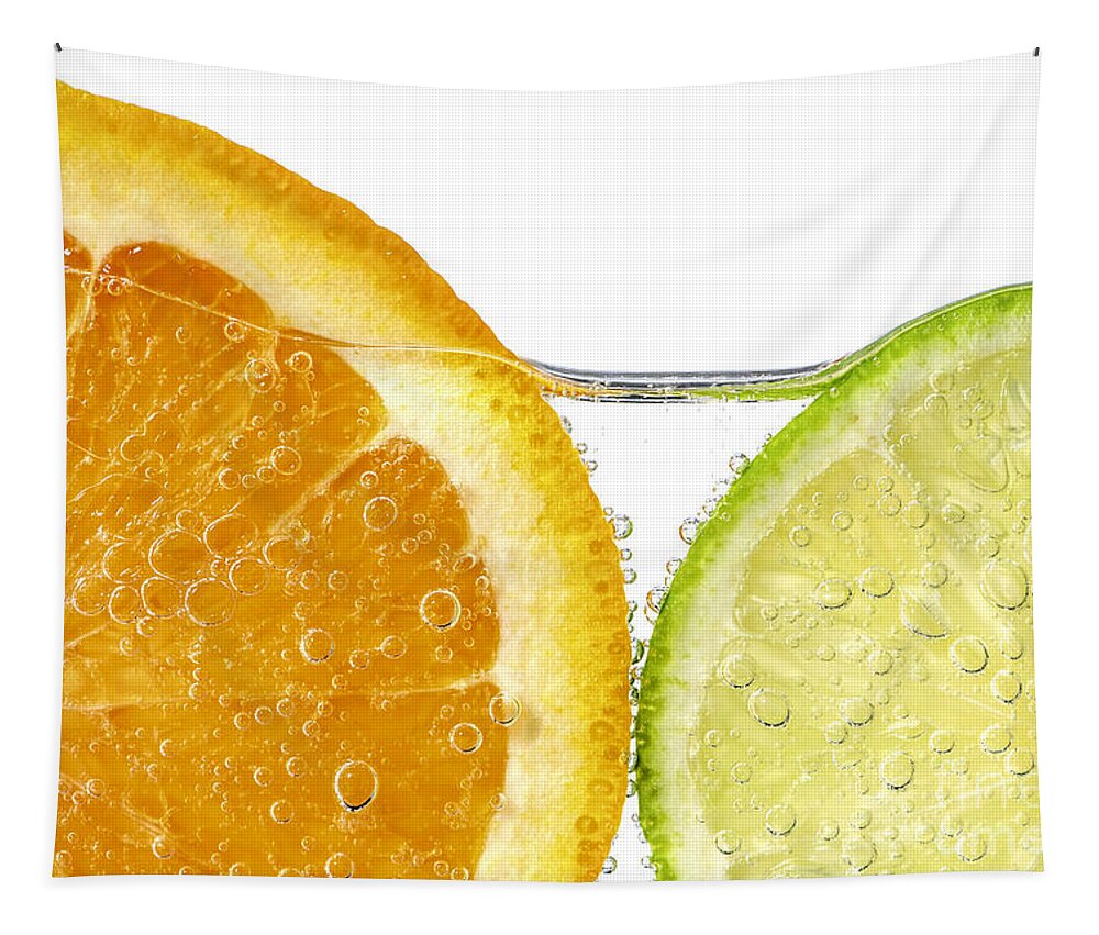 Orange Tapestry featuring the photograph Orange and lime slices in water by Elena Elisseeva