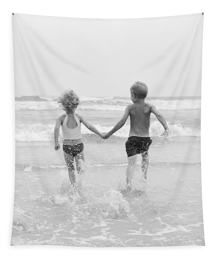 1960s Tapestry featuring the photograph Two Children Running Into The Ocean by H Armstrong Roberts and ClassicStock
