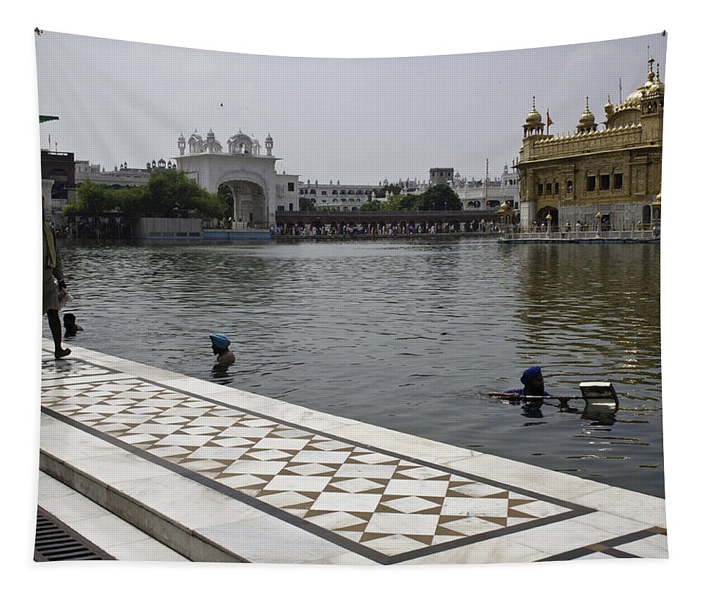  Tapestry featuring the photograph Clearing the sarovar inside the Golden temple resorvoir by Ashish Agarwal