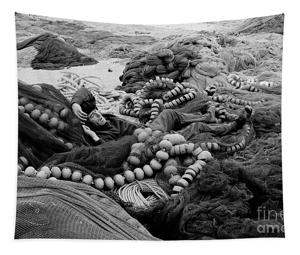 Fishing Nets Tapestry featuring the photograph Fisherman Sleeping on a Huge Array of Nets by Tom Wurl