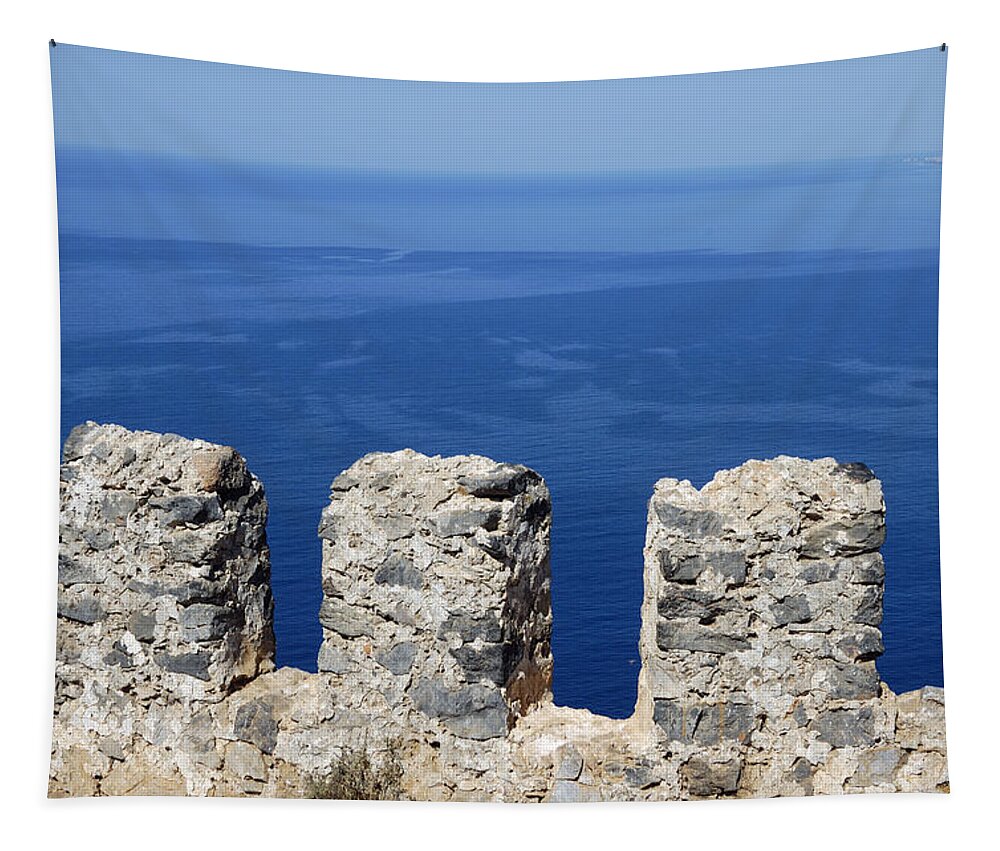 Castle Tapestry featuring the photograph Fortification wall and blue ocean by Matthias Hauser