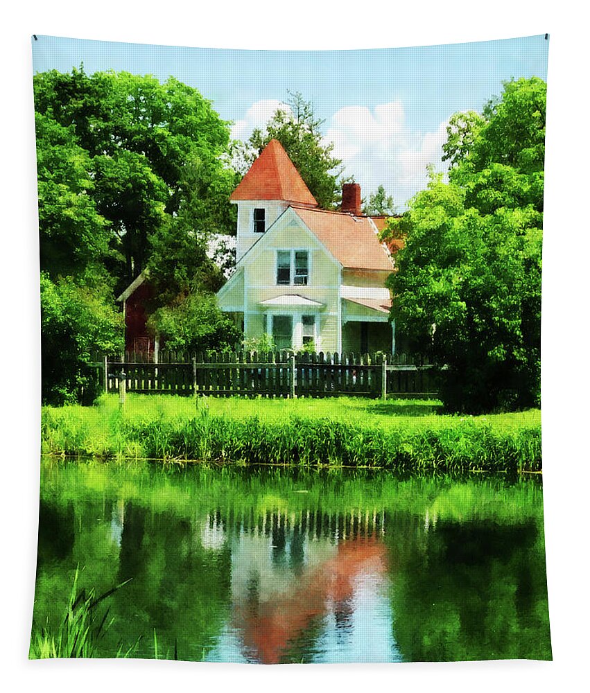 Lake Tapestry featuring the photograph Suburban House with Reflection by Susan Savad