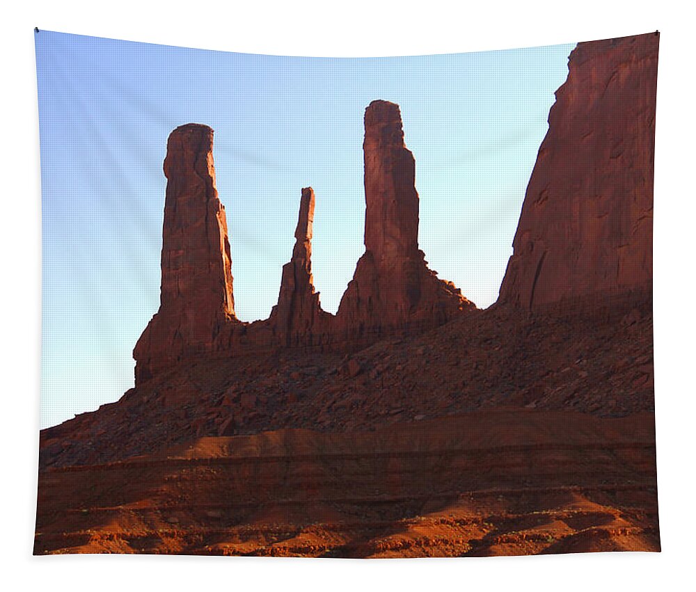 Desert Scene Tapestry featuring the photograph Three Sisters - Monument Valley by Mike McGlothlen