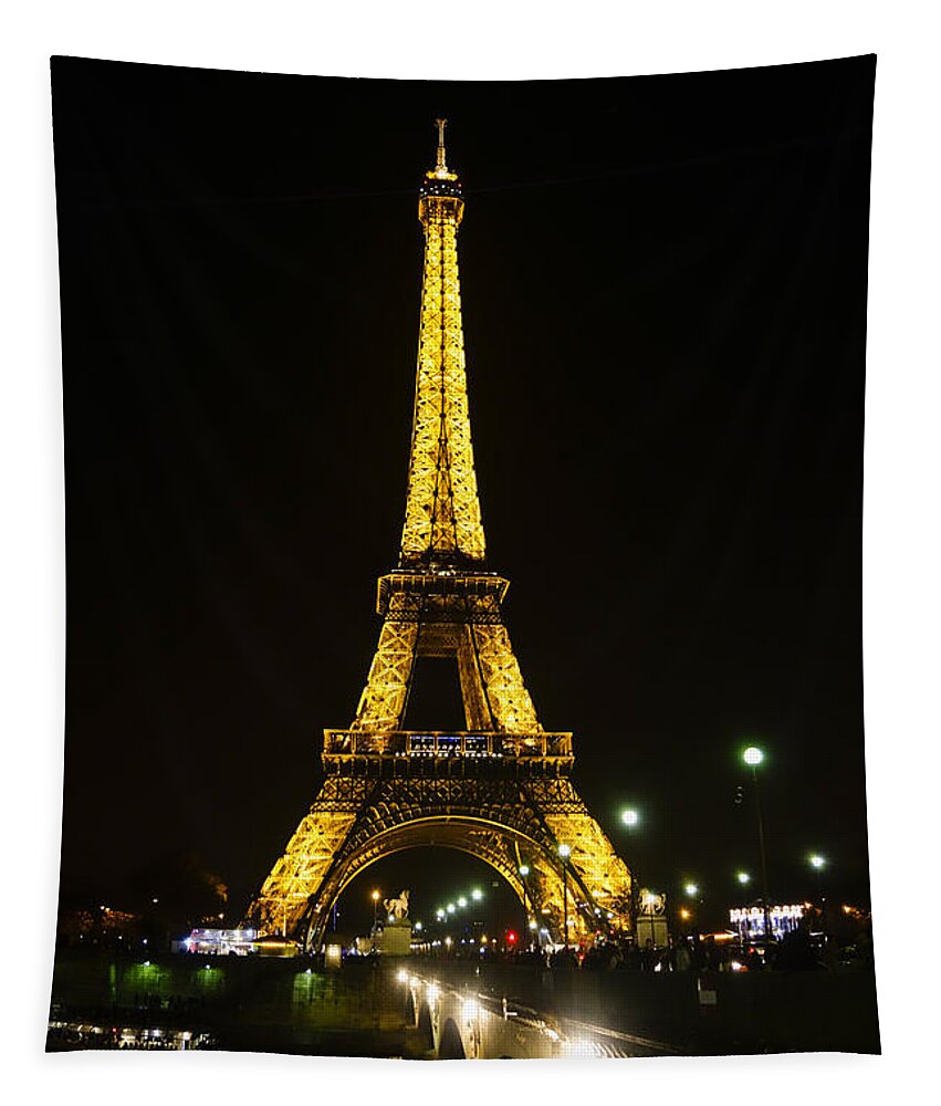 Eiffel Tower Tapestry featuring the photograph The Eiffel tower at night illuminated, Paris, France. #1 by Perry Van Munster