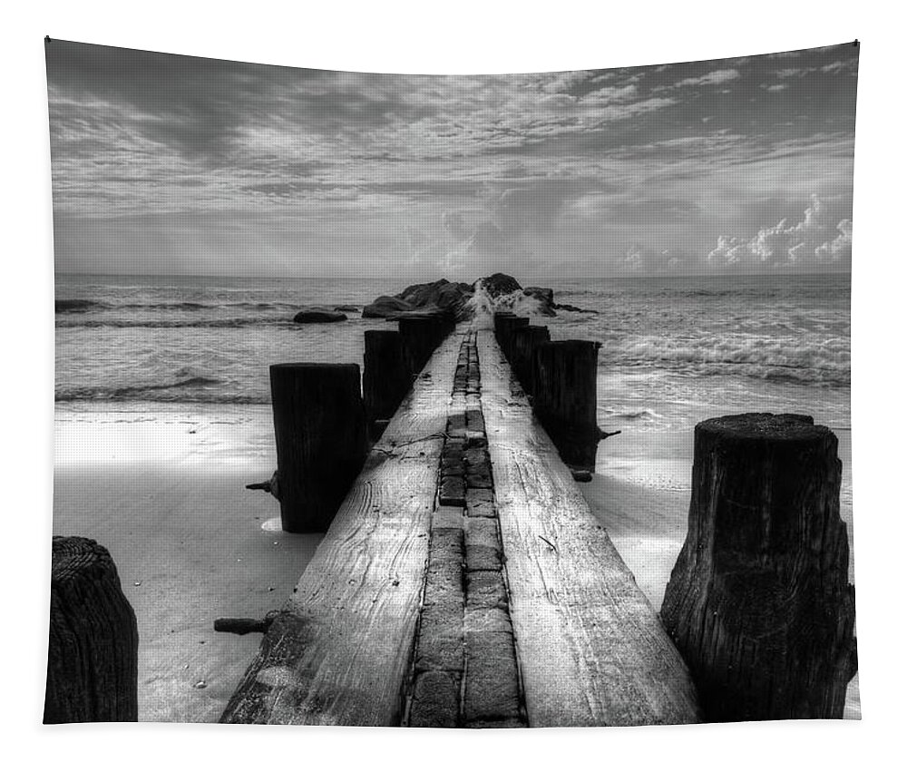 Folly Beach Pilings Tapestry featuring the photograph Folly Beach Pilings Charleston South Carolina In Black and White by Carol Montoya