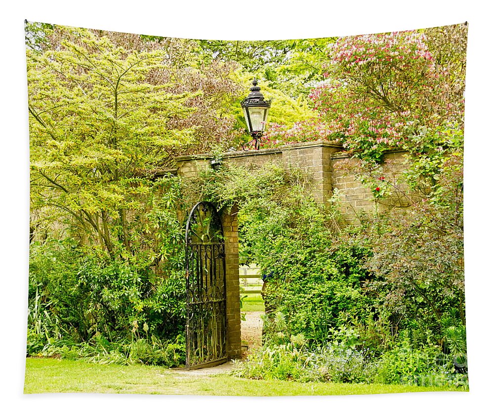 Garden Wall Tapestry featuring the photograph Garden Wall With Iron Gate And Lantern. by Elena Perelman