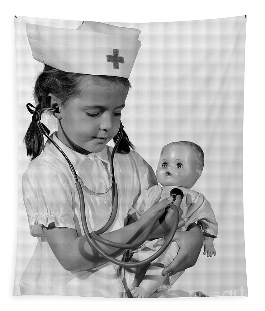 1960s Tapestry featuring the photograph Girl Playing Nurse With Doll, C.1960s by H Armstrong Roberts ClassicStock