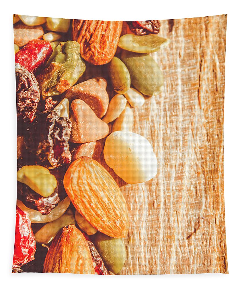 Nuts Tapestry featuring the photograph Mixed nuts on wooden background by Jorgo Photography