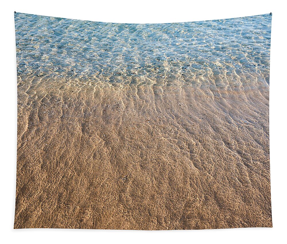 Abstract Tapestry featuring the photograph Seashore clear water with sandy beach for background by Michalakis Ppalis