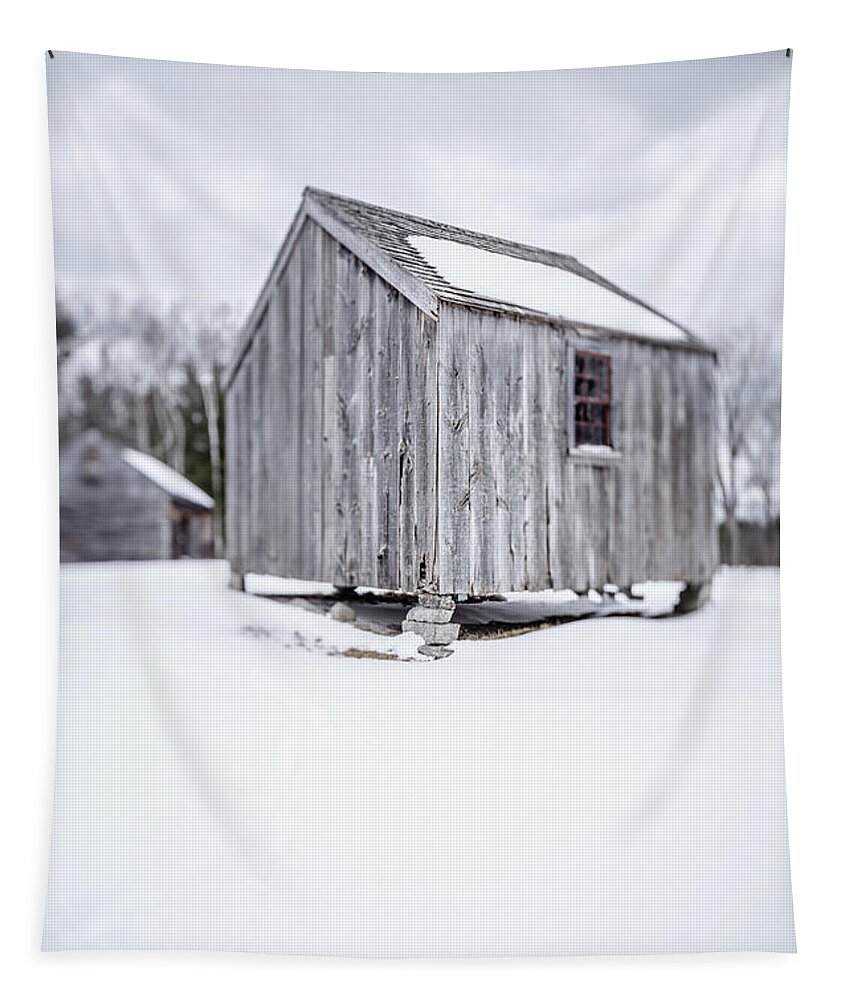 Corn Crib Tapestry featuring the photograph Small old wooden barn on a farm in winter by Edward Fielding