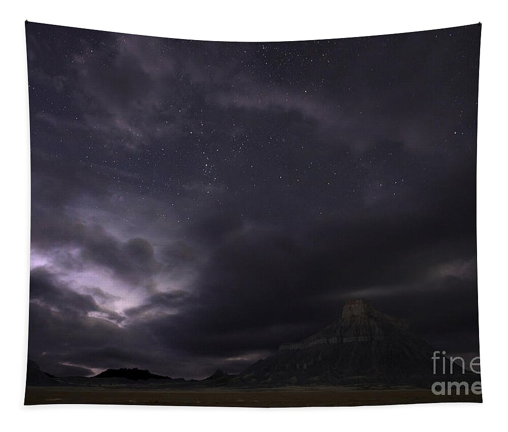 Factory Butte Tapestry featuring the photograph Storm over Factory Butte by Keith Kapple