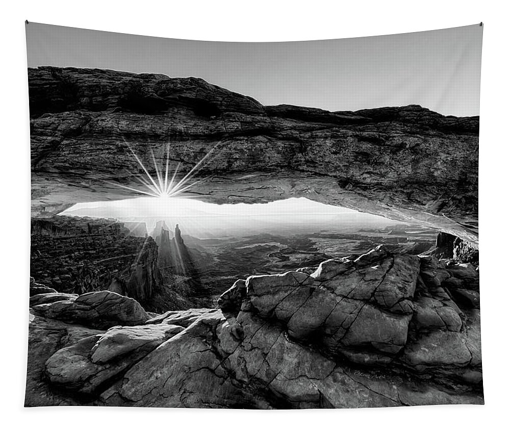 Mesa Arch; Utah; Canyonlands; National Park; Sunrise; Arch; Red; Brown; Desert; Butte; Dawn; Morning; Remote; Beauty; Sun; Sunburst; Rays; Sunlight Glowing Tapestry featuring the digital art Supernatural West - Mesa Arch Sunburst in Black and White by OLena Art by Lena Owens - Vibrant Design