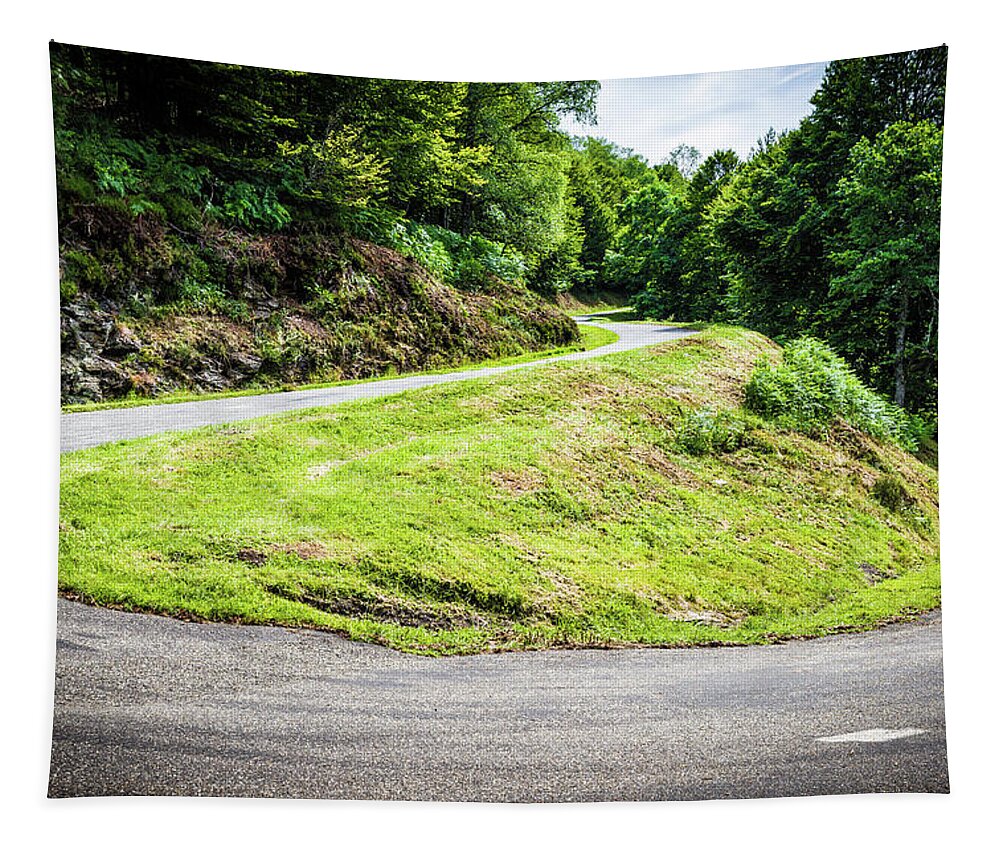 Boussenac Tapestry featuring the photograph Winding road with sharp bend going up the mountain by Semmick Photo
