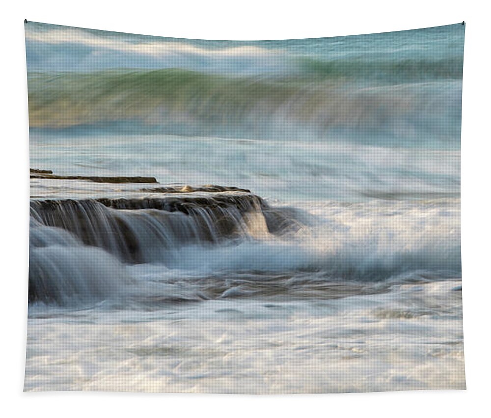Seascape Tapestry featuring the photograph Rocky seashore with wavy ocean and waves crashing on the rocks #1 by Michalakis Ppalis