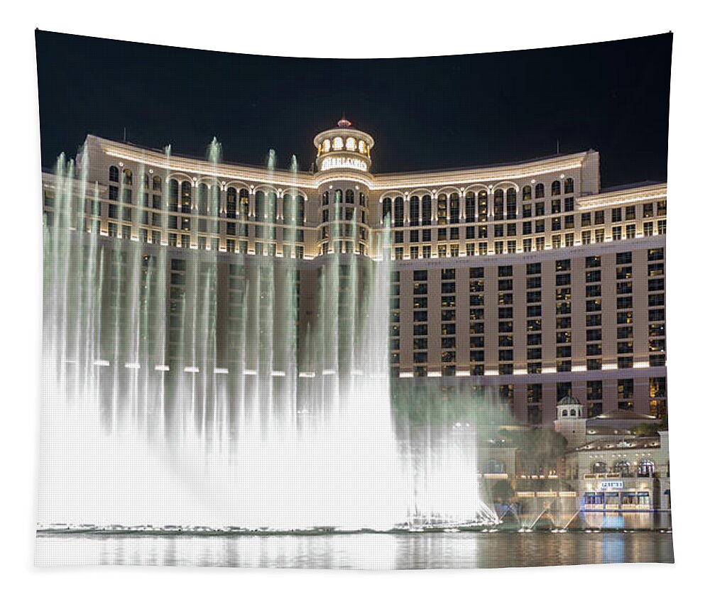 Water Tapestry featuring the photograph Bellagio Resort water fountain show at night #2 by Alex Grichenko