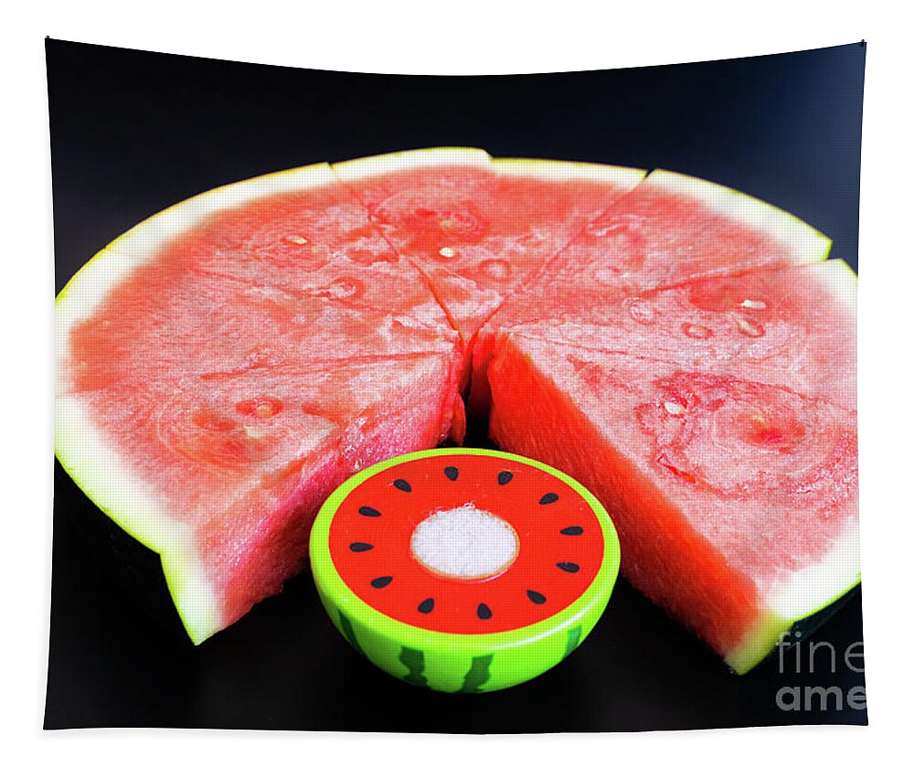 Backdrop Tapestry featuring the photograph A large slice of watermelon divided into smaller pieces next to by Joaquin Corbalan