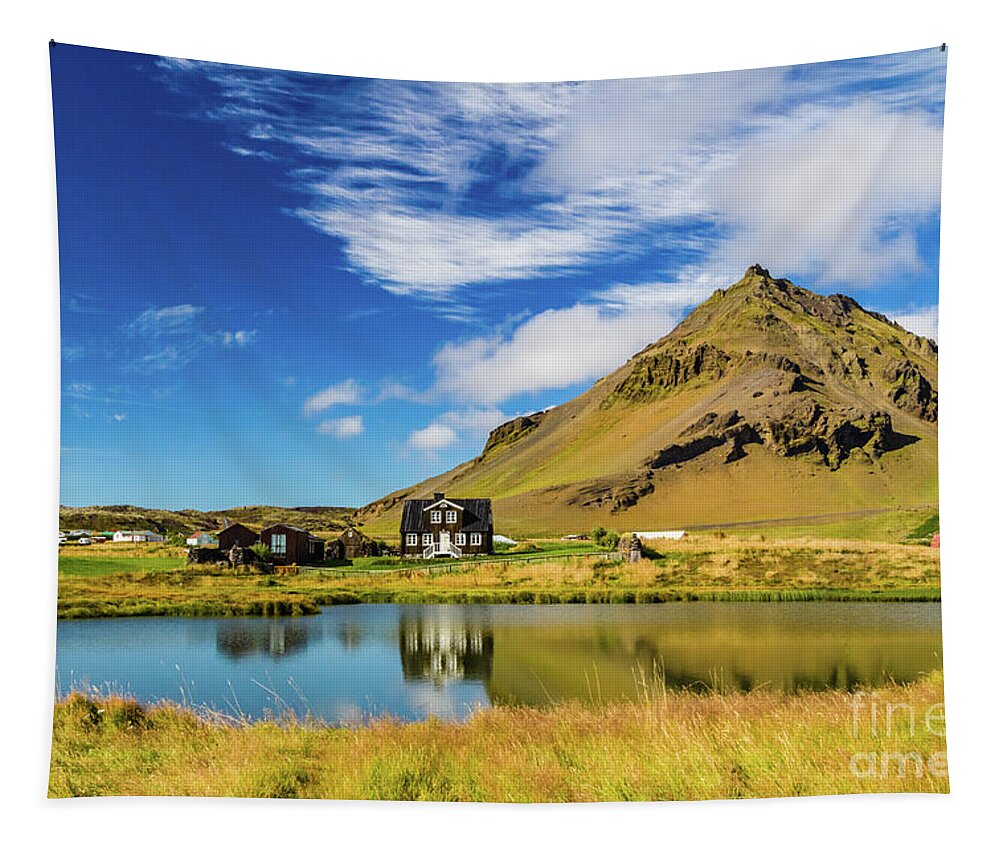 Arnarstapi Tapestry featuring the photograph Arnarstapi Amtmansshus and Mount Stapafell, Iceland by Lyl Dil Creations