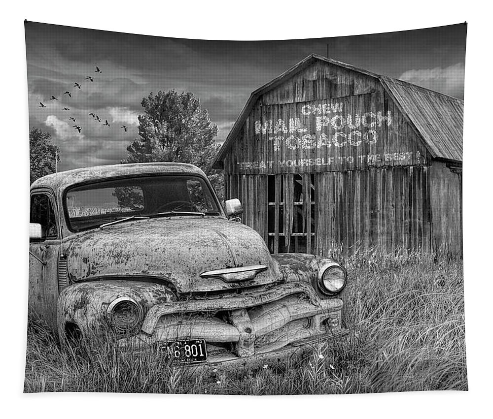 Chevy Tapestry featuring the photograph Black and White of Rusted Chevy Pickup Truck in a Rural Landscape by a Mail Pouch Tobacco Barn by Randall Nyhof