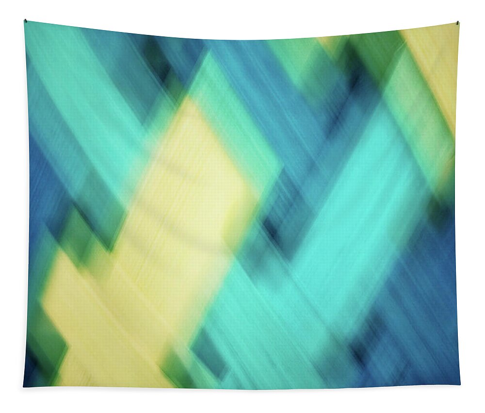 Abstract Tapestry featuring the photograph Bright blue, turquoise, green and yellow blurred diamond shapes abstract by Teri Virbickis