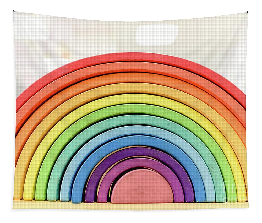 Arrangement Tapestry featuring the photograph Colorful Waldorf wooden rainbow in a montessori teaching pedagogy classroom. by Joaquin Corbalan