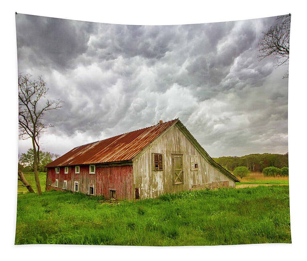 East Moriches Red Barn Storm Clouds Spring Green Grass Farm Field Stormy Rural Long Island New York Tapestry featuring the photograph East Moriches Red Barn Storm by Robert Seifert