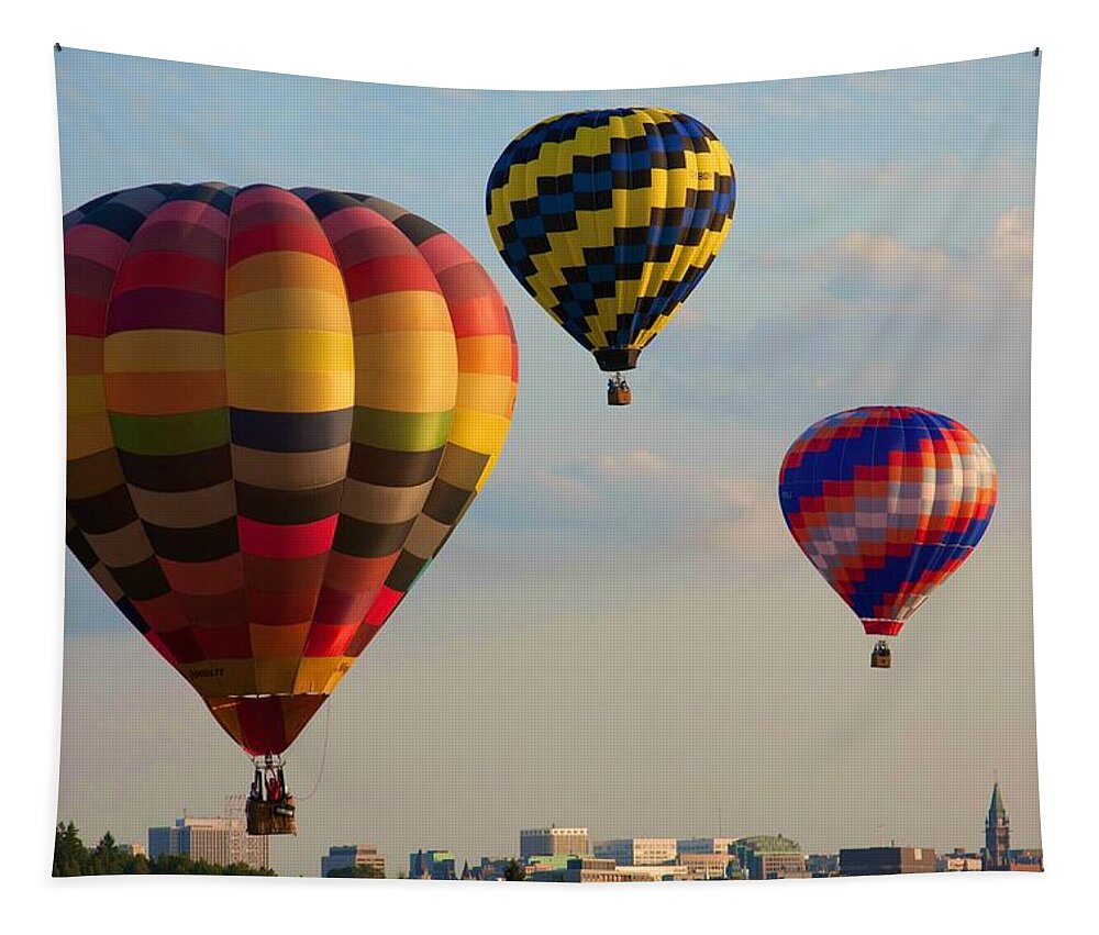 Hot Air Balloons Tapestry featuring the photograph Hot air balloons flying over the city by Tatiana Travelways