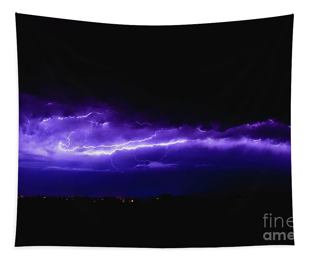 Background Tapestry featuring the photograph Rays in a night storm with light and clouds. by Joaquin Corbalan