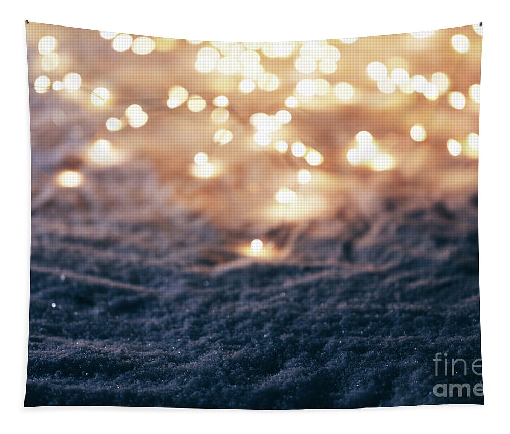 Winter Tapestry featuring the photograph Snowy winter background with fairy lights. by Michal Bednarek