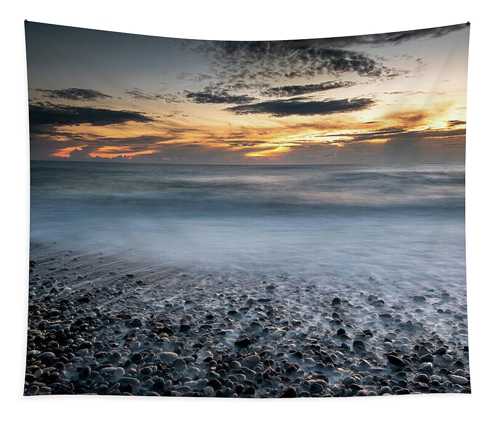 Seascape Tapestry featuring the photograph Seawaves splashing on the coast during a dramatic sunset #2 by Michalakis Ppalis
