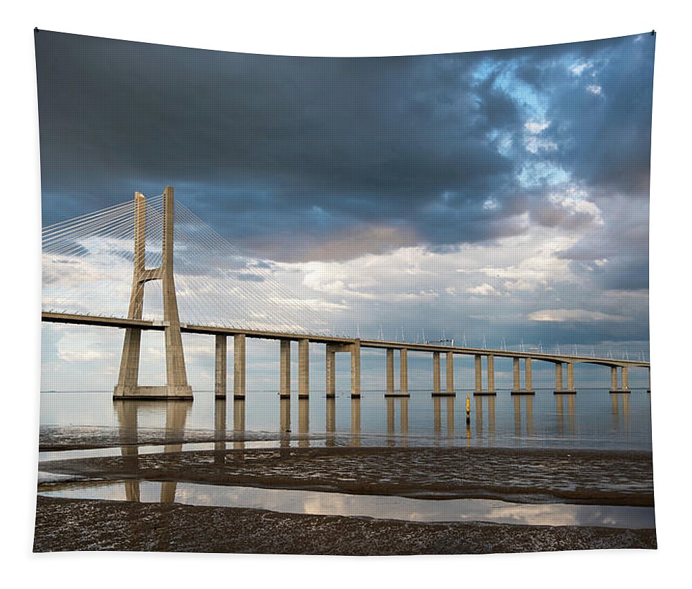 Vasco Da Cama Bridge Tapestry featuring the photograph Vasco da Gama Bridge at sunset in Lisbon, Portugal #5 by Michalakis Ppalis