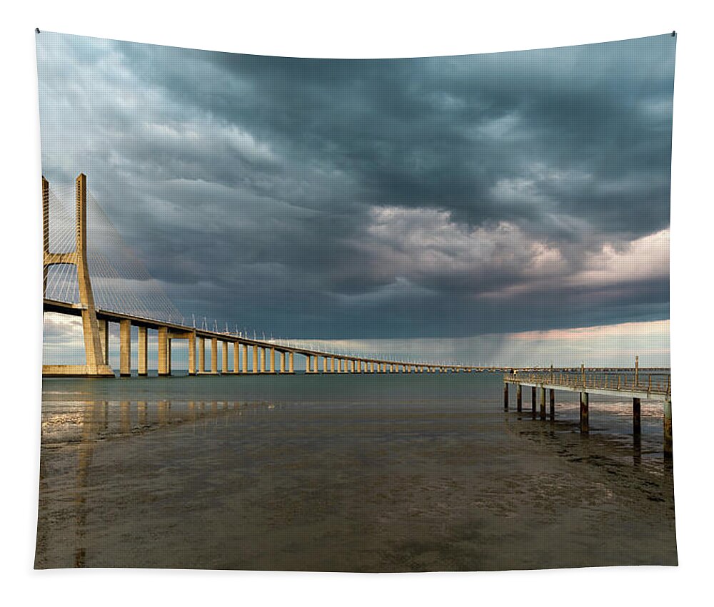 Vasco Da Gama Bridge Tapestry featuring the photograph Vasco da Gama Bridge at sunset in Lisbon, Portugal #2 by Michalakis Ppalis