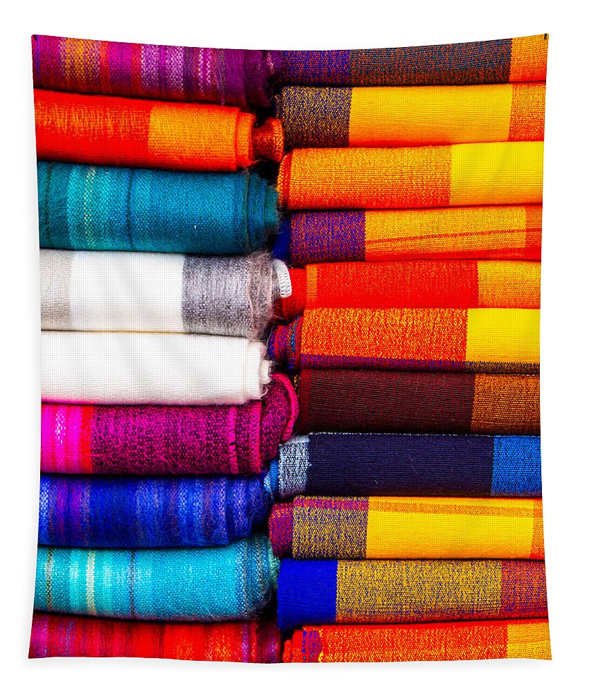 Color Tapestry featuring the photograph A Stack of blankets for sale at the Otavalo Market in Ecuador by L Bosco