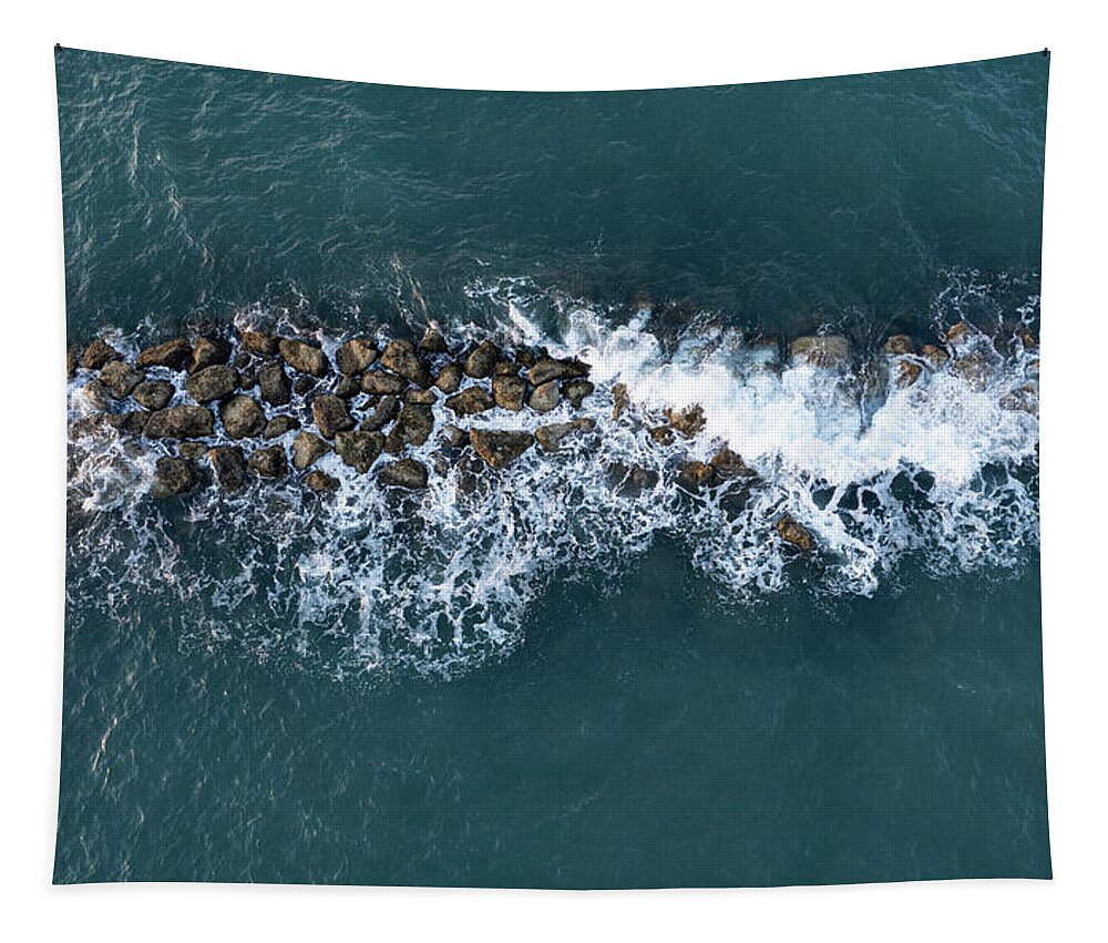 Ocean Tapestry featuring the photograph Aerial view from a flying drone of blue sea water and break water. Sea wall coastline by Michalakis Ppalis